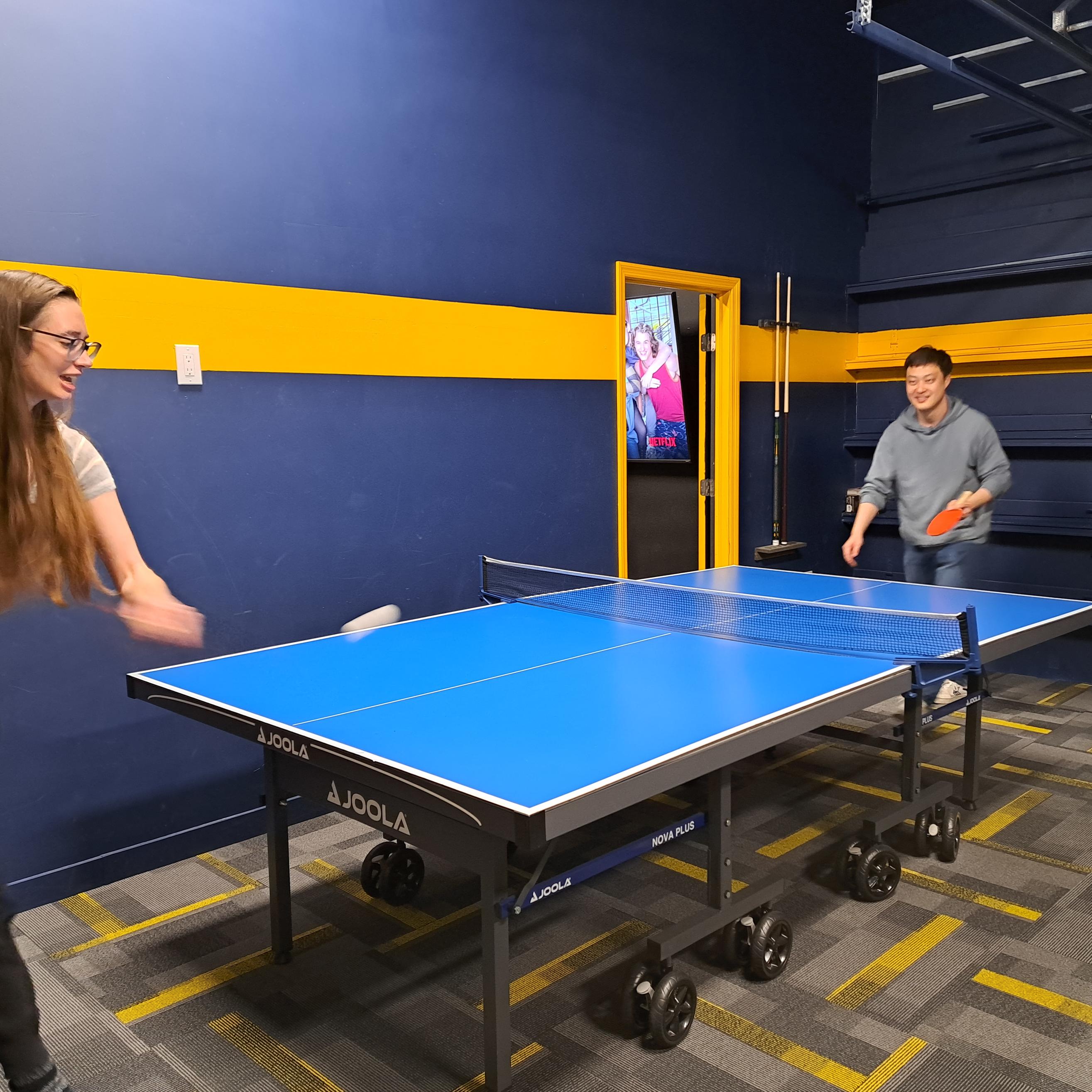 Clara and Hu playing ping pong